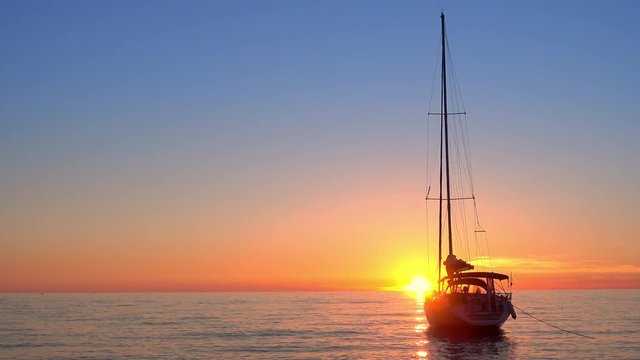 sailing yacht docked at the sunset