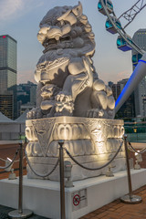 Sunset on Hong Kong island seen by a typical Chinese lion