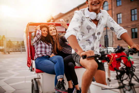Female friends taking selfie on tricycle