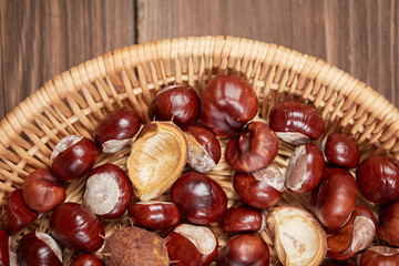 Chestnuts on a wooden table top view