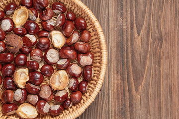 Chestnuts on a wooden table top view