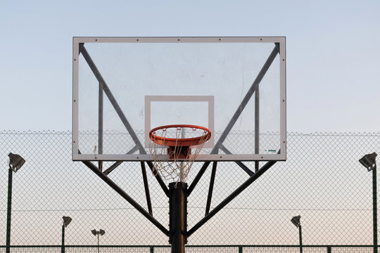 Basketball hoop. Detail of a basketball on a street court.