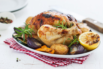 Homemade christmas chicken with vegetables on a plate, closeup.