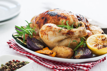 Homemade christmas chicken with vegetables on a plate, closeup