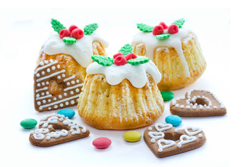 Christmas cakes with traditional decoration, candy and cookies