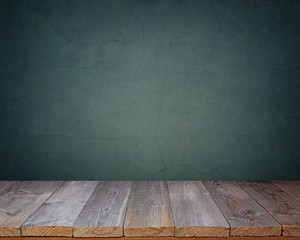 Blank wooden table on a background of the blue wall.