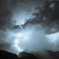 Photo sur Aluminium brossé Orage Lightning over the mountains, thunderbolt.