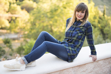 Woman in outdoors posing with square shirt style