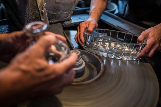 Glassblowers working on a glass