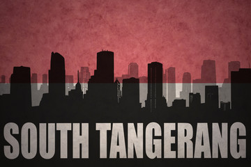 abstract silhouette of the city with text South Tangerang at the vintage indonesian flag background