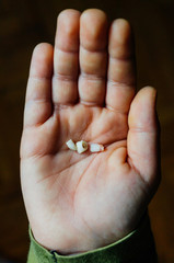  Child holding baby teeth