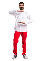 Handsome man with glasses holding something