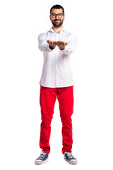 Handsome man with glasses holding something