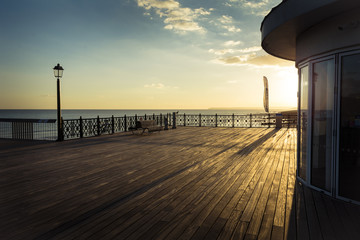 Deck of the new Hasting pier in late afternoon sunshine