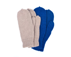 Chunky knit wool mittens separated on white background