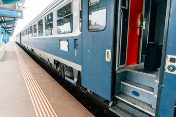 Fototapeta na wymiar Open train door at platform