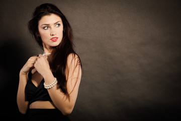 Fototapeta premium woman in sensual black dress on dark