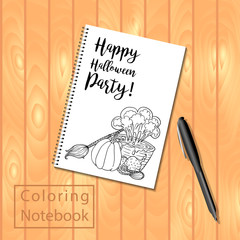 Spiral bound notepad or coloring book with pencils and Halloween picture