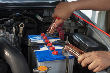 Charging battery car with electricity trough jumper cables