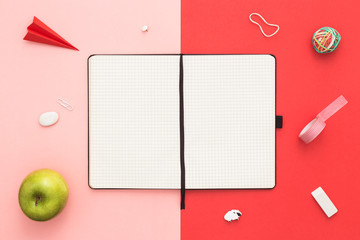 Notepad on young student desk. Creative flat lay. Back to school concept. Top view.