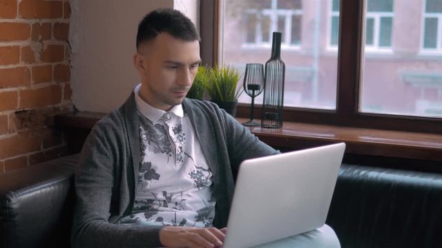 Young Entrepreneur Freelancer Working using a Laptop and in Coworking