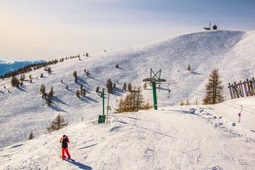 A lift is bringing skiers to top of the gerlitzen mountain in austria