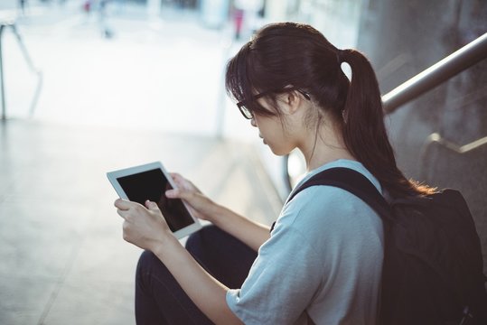 Woman using digital tablet