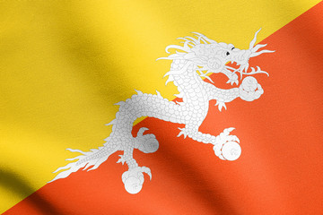 Flag of Bhutan waving with fabric texture