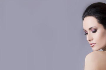 Obraz premium Studio portrait of young beautiful brunette woman. Close up