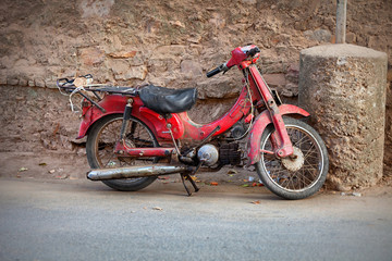Fototapeta na wymiar Old red motorbike