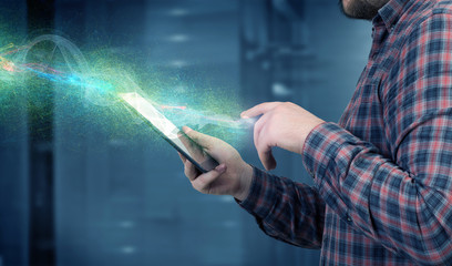 Man using digital tablet . Mixed media