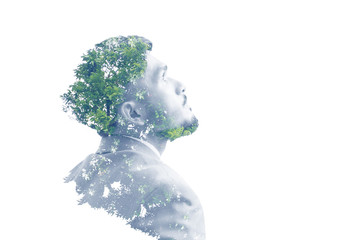 Double exposure of businessman and tree