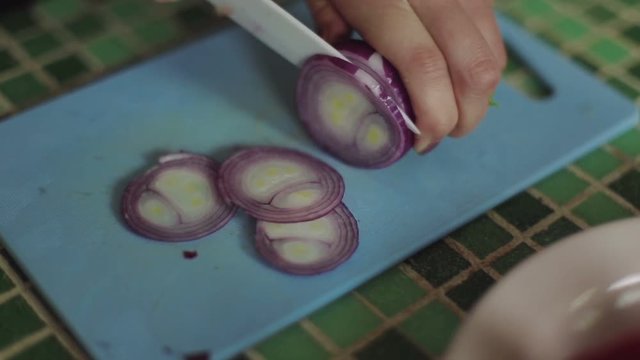 Professional Cook Rapidly Chopping Onion, Close-Up. Shot on RED Digital Cinema Camera in 4K ultra-high definition UHD , so you can easily crop, rotate and zoom, without losing quality
