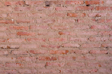 Old grunge red brick wall as background