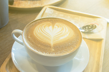 cup of coffee with heart pattern