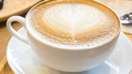 cup of coffee with heart pattern