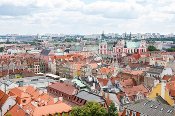 Fototapeta na wymiar Poznan, Poland - June 28, 2016: View on buildings and collegiate church in polish town Poznan