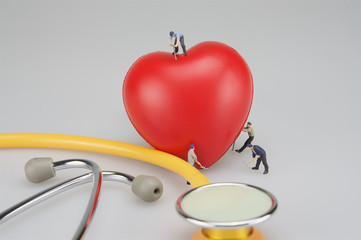 Miniature people cure heart and stethoscope