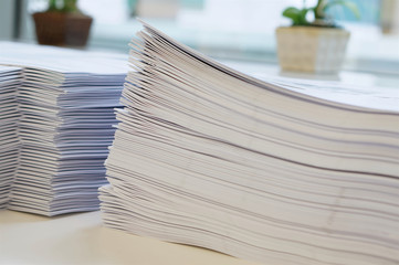 Printout on desk near window at office