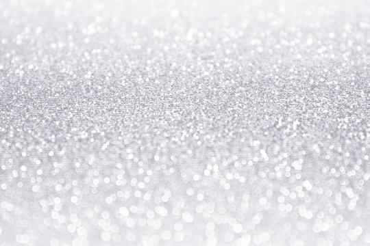 Elegant white and silver glitter sparkle confetti background or party invitation