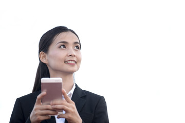 beautiful young asian woman smile looking at mobile smartphone