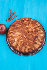 Homemade apple cake on a turquoise background