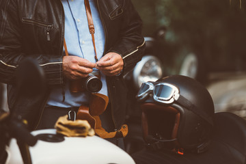 Man with film camera at bike exhibition