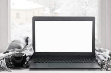Laptop on winter window - 122712390