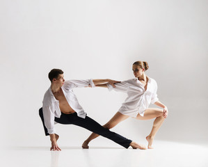 Couple of sporty ballet dancers in art performance.
