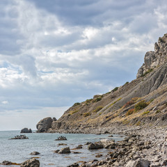 Fototapeta na wymiar Russia, peninsula of Crimea, near Sudak. Mountain and Cape Alchak-Kaya, Kapsel bay.