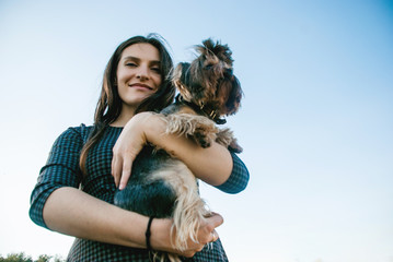 Young woman with yorkshire terrier