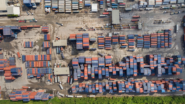 Aerial view of cargo containers piled together.