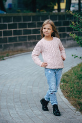 beautiful young girl posing on the street