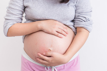 Pregnant woman touching her belly